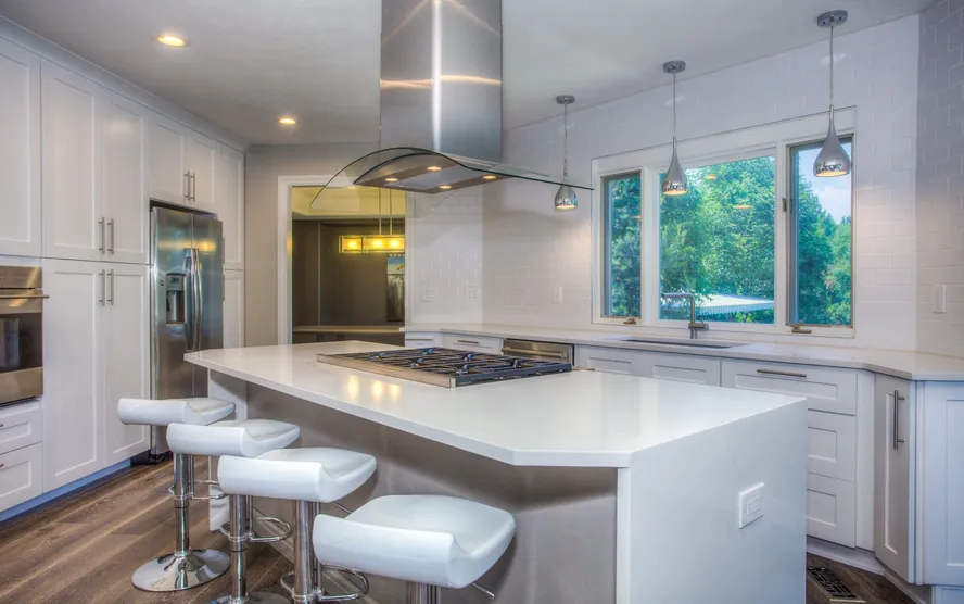 A finished kitchen with a large island